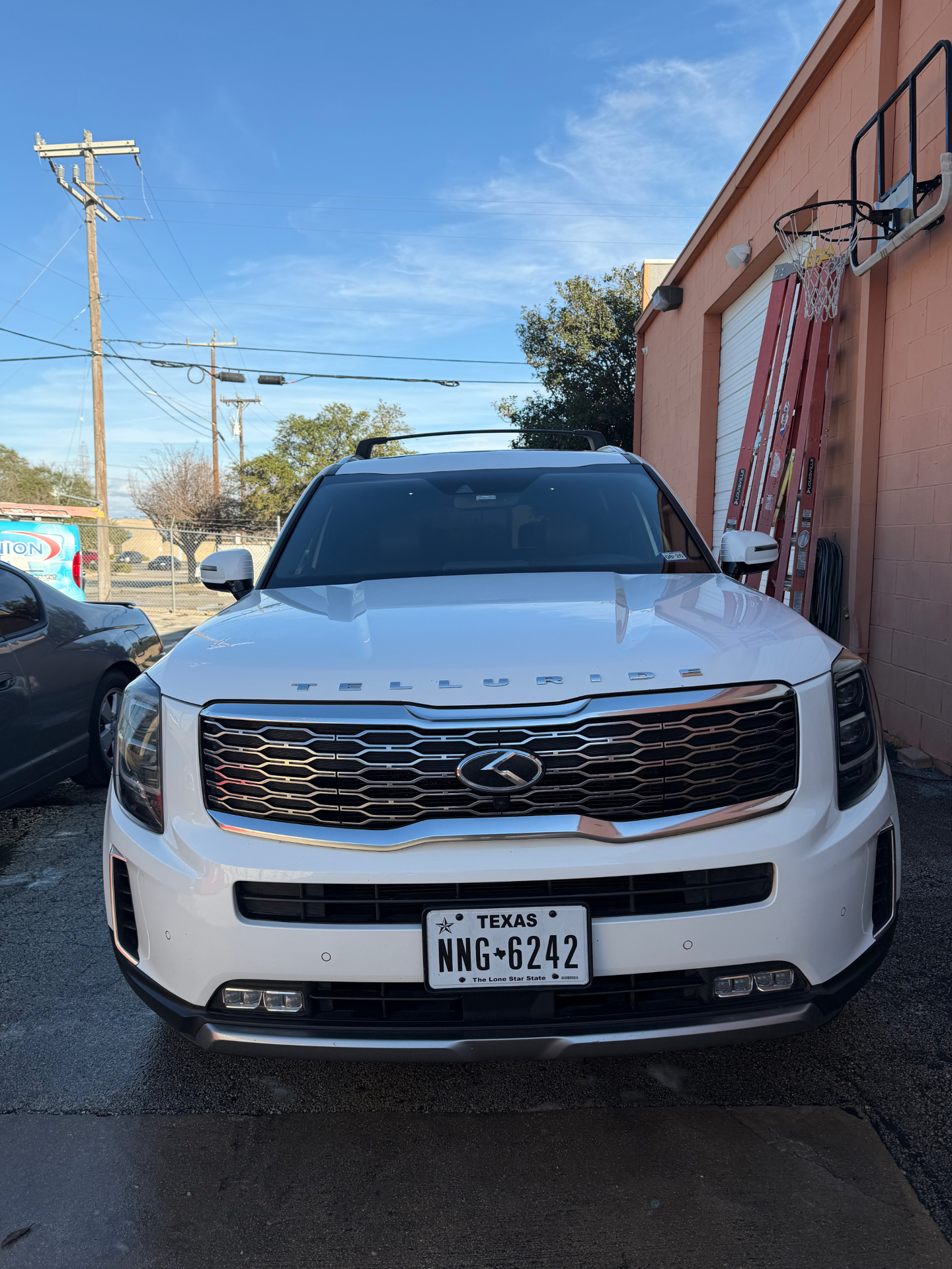 Same white Kia Telluride cleaned and gleaming after detailing